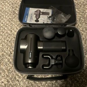 Massage kit fully works and comes with carrying case and attachments.